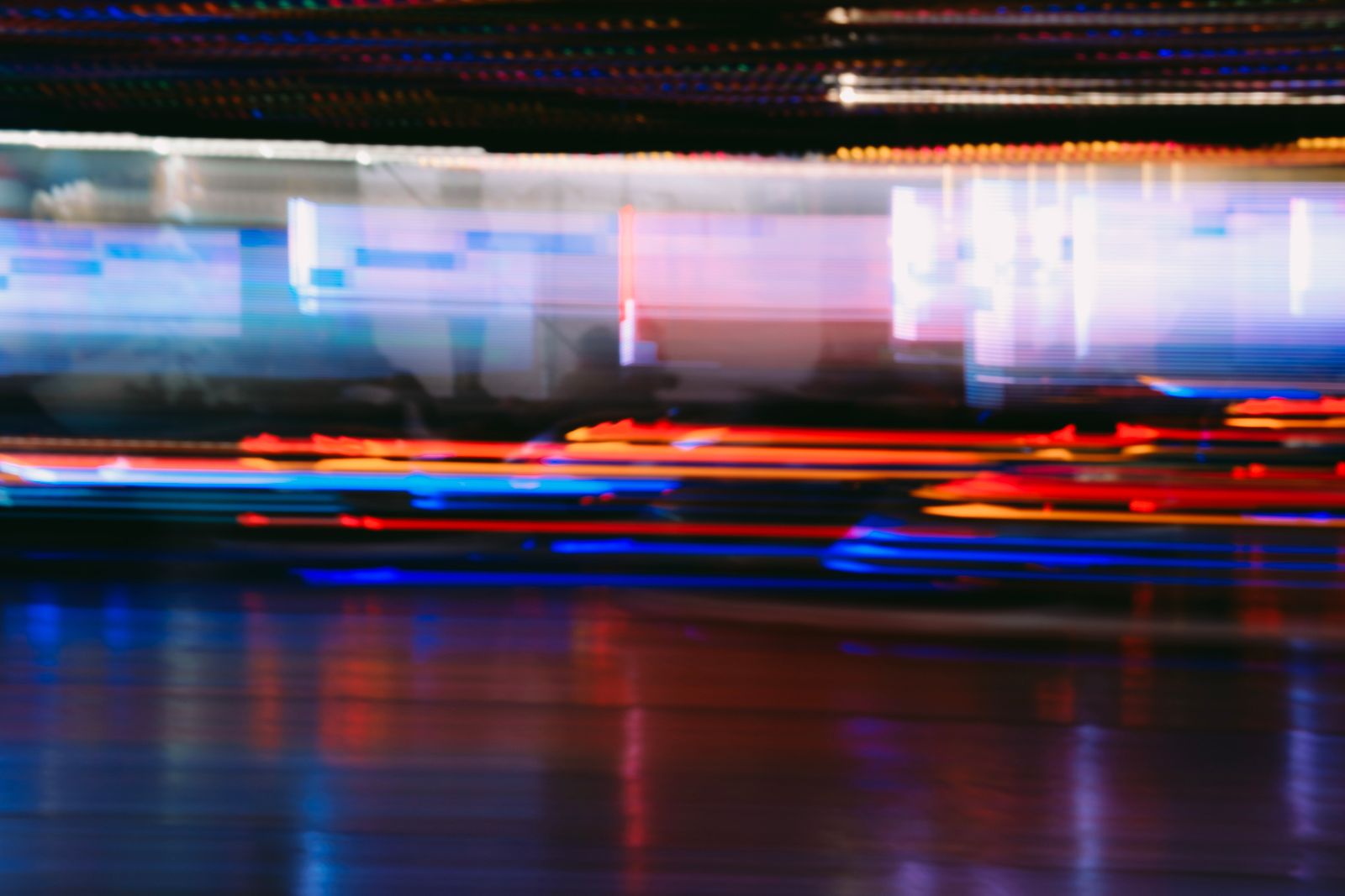 Blurred city lights in motion at night — a nod to the early-internet era