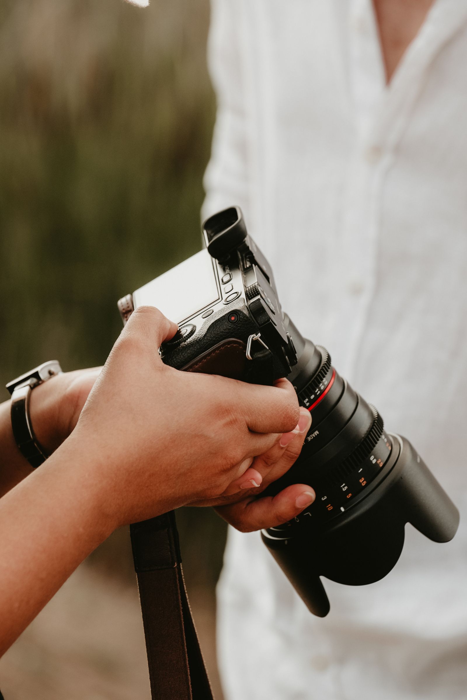 A person adjusting a camera in their hands — the format is constantly being refined too