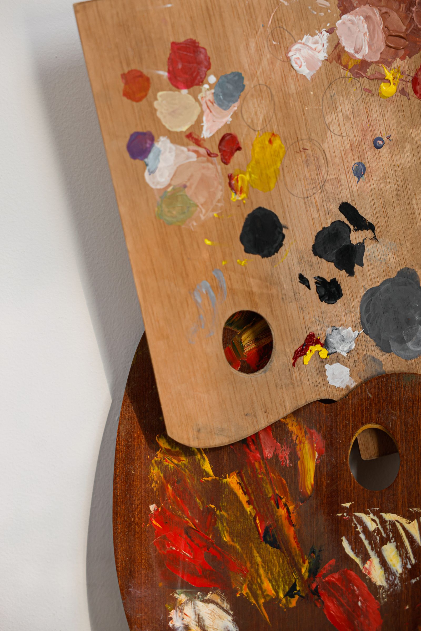 Artist's palettes with brushstrokes of paint in many colors