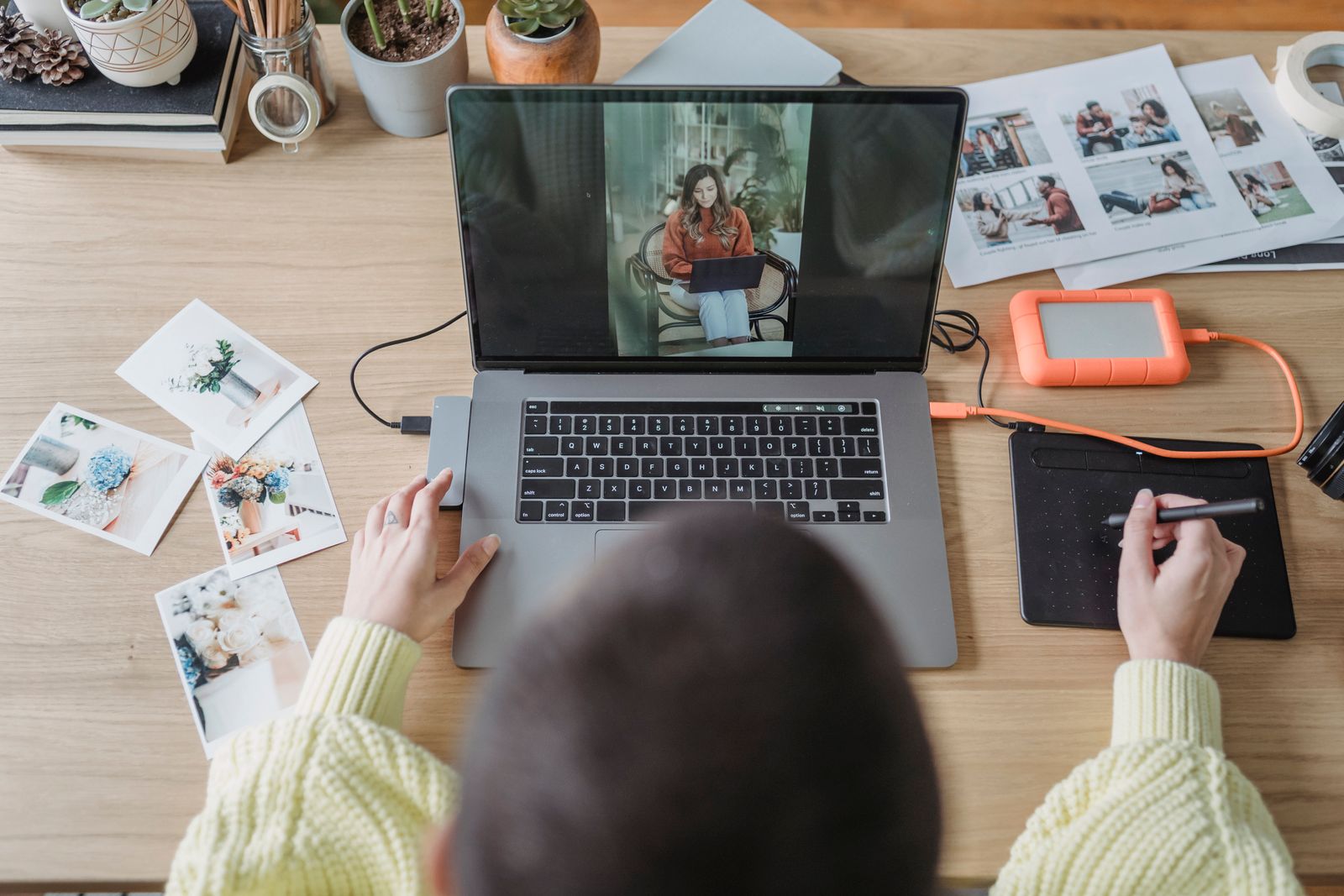 A grid of photos in Lightroom on a laptop — viewing and editing shots